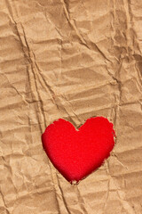Fototapeta na wymiar Red heart cut in cardboard