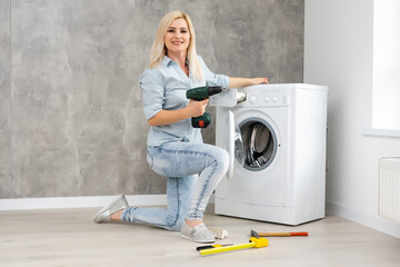 Plumber fixing broken washing machine