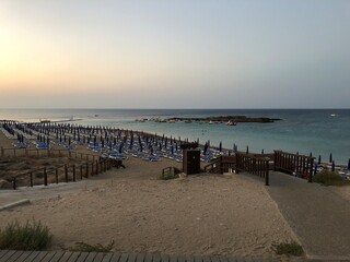 Fototapeta premium the beach of Fig tree bay. sunset on the sea. Cyprus. the Mediterranean sea