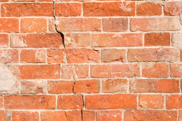 Obraz premium Texture background of old brick wall with crack