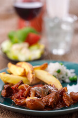 greek stifado meat stew with fries