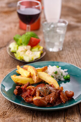greek stifado meat stew with fries