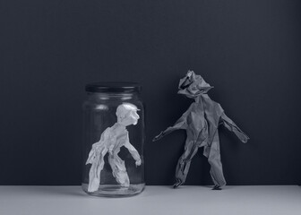 Human figures made from crumpled paper. Isolation concept.