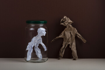 Human figures made from crumpled paper. Isolation concept.