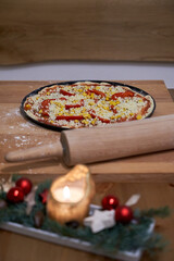 Closeup of homemade pizza with christmas decoration