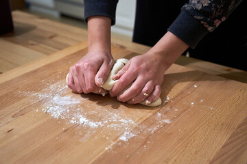Closeup of female hands baking