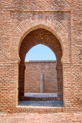 Arab architectural style door located in the Alcazaba, a palatial fortification from the Islamic period of the 11th century built in Malaga, Costa del Sol, Andalusia, Spain.