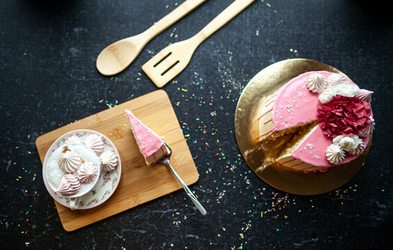 Delicious cake on black stone table