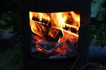 Fire flame and wood burning in fireplace