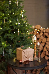 Home Christmas decoration interior late in night with light on xmas tree and gifts.