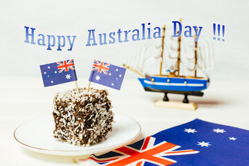 Iconic traditional Australian party food, Lamington cakes on a red, white and blue background.