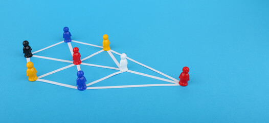 the concept of connections in an abstract community. multicolored figures of people in the form of a community. 