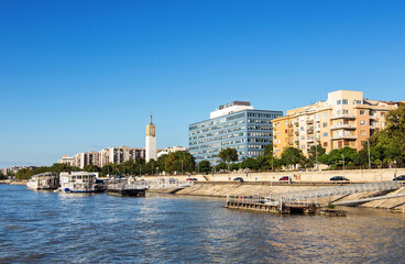 Naklejka premium View of Budapest embankment wit ancient and modern buildings on the river Danube in Hungary in a beautiful summer day