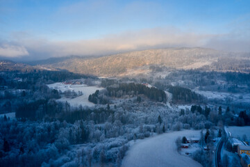 Winter Landscape with a feeling of christmas. Drone photo from the Norway. It's cold and snow is coming. 