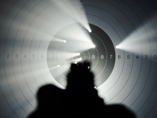 Light coming out of target bullet holes after pistol range shooting