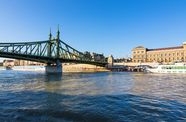 Liberty Bridge or Freedom Bridge connects Buda and Pest and crosses the Danube River in Budapest, Hungary. It is the third southernmost public road bridge in Budapest.
