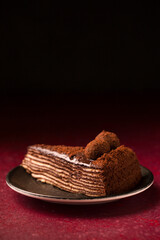Spartacus chocolate cake on a burgundy background