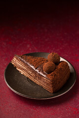 Spartacus cake on a burgundy background