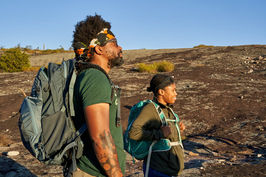 Diverse group of friends hiking Arabia Mountain in USA
