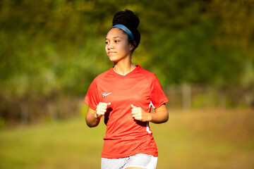 Teenage girl soccer player outdoors
