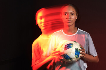 Young female soccer player in motion colorful portrait