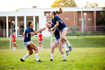 Teen girls celebrating after successful game victory