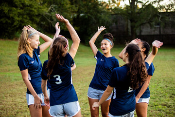 Female team huddled together before game