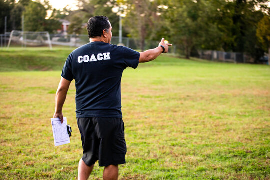 Man coaching girls soccer team