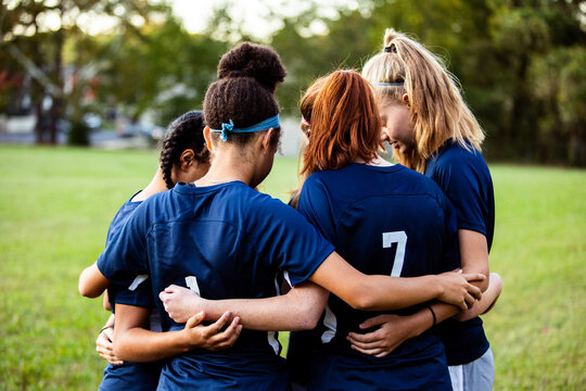 Female team huddled together before game