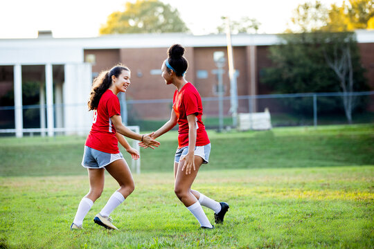 Teen girls celebrating after successful goal