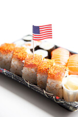 Sushi food on tray with American flag against white background