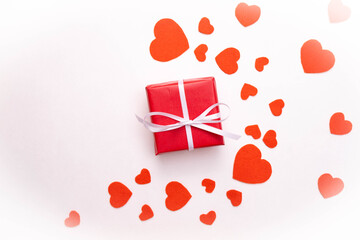 a gift, and around a heart made of matter on a white background