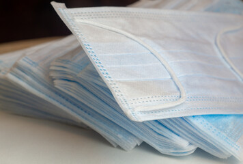 The most sought after coronavirus covid-19 protection item in worldwide. Stack of facial medical masks..