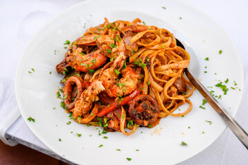 Pasta with grilled seafood. Traditional Greek dish.
