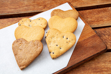 Chocolate cookies on wooden table. Chocolate chip cookies shot