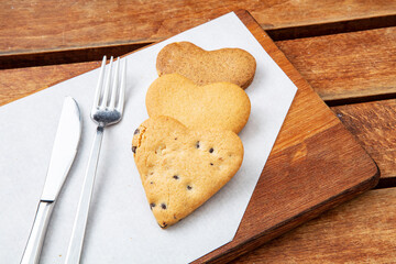 Chocolate cookies on wooden table. Chocolate chip cookies shot