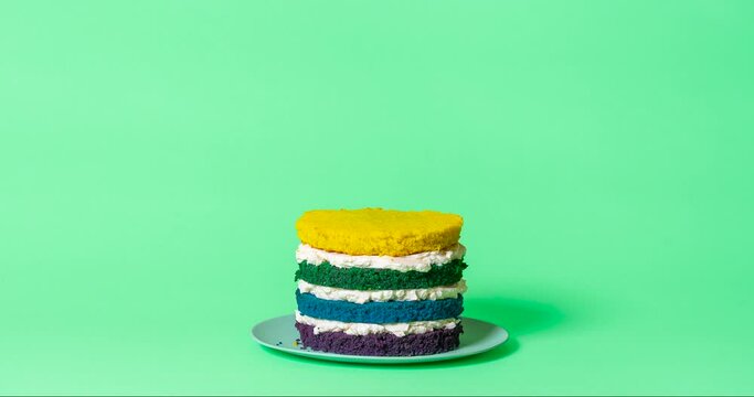 Birthday cake making of, stop motion. Homemade rainbow cake with buttercream.

