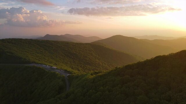 Aerial over the Blue Ridge Mountains at sunset near Asheville, North Carolina.