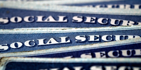 Social Security Cards in a Row Pile for Retirement