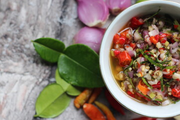 Sambal Jeruk Nipis Or Spicy Lime Sauce with ingredients, Lime, Red Chilies, Green Chilies, garlic, and salt. 