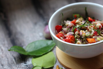 Sambal Jeruk Nipis Or Spicy Lime Sauce with ingredients, Lime, Red Chilies, Green Chilies, garlic, and salt. 