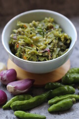 Sambal ijo Or Green chili sauce with ingredients, Greem chilies, onion, garlic, and salt 