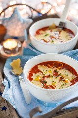 Christmas Tomato Soup with Ornament Shaped Pasta. Winter Decoration.