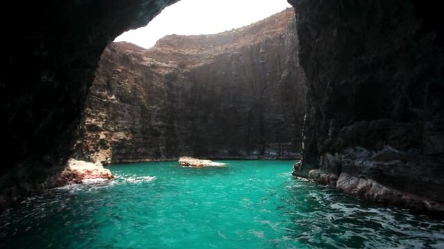 Wide, water flows through secret cave in Kauai