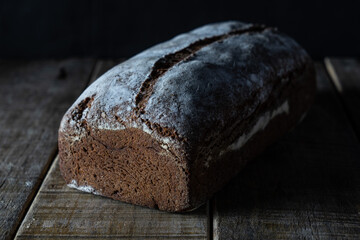 Freshly baked grain oats brown bread close up photos. Gastronomic photography.
Dark food  photography