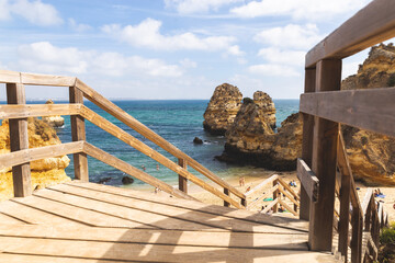 Praia da Boneca do Camilo Lagos Portugal staircase stairs stairway to the beach water ocean Atlantic rock formations hills 