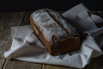 Freshly baked grain oats brown bread close up photos. Gastronomic photography.
Dark food  photography