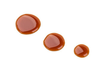 Dark syrup drops, isolated on white background
