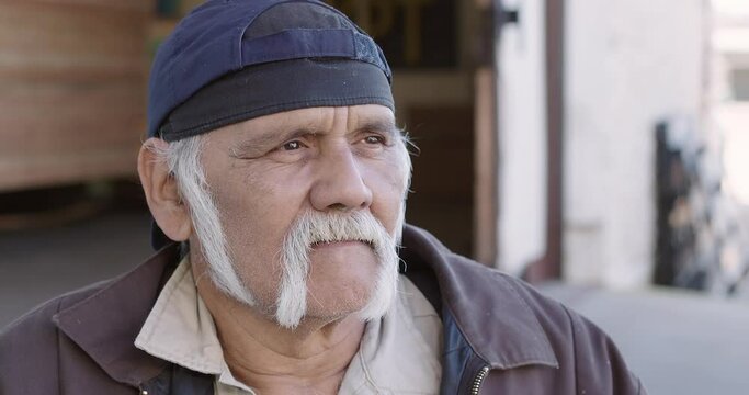 Portrait of older worker looking at camera