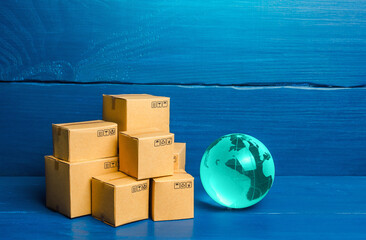 Planet Earth globe and boxes. Global business and world trade. Distribution of goods, import and...